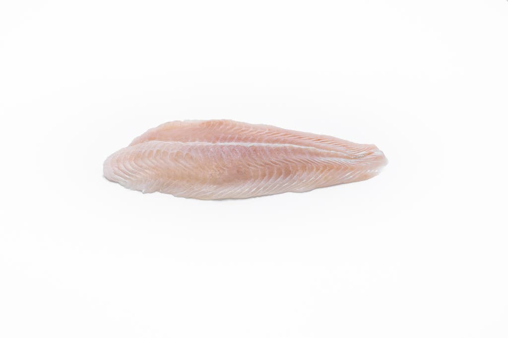 Pangasius Fillet Frozen 170-220 gr. 80% NW Untrimmed Belly On Skinless Boneless IQF